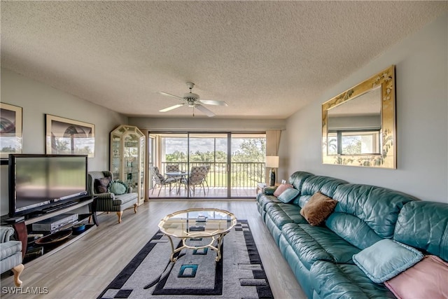 6979 Winkler Rd Unit 131, Fort Myers, FL 33919 - living area with a textured ceiling, ceiling fan, and wood finished floors