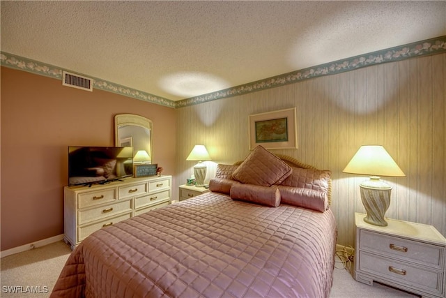 6979 Winkler Rd Unit 131, Fort Myers, FL 33919 - bedroom featuring light colored carpet, a textured ceiling, and baseboards