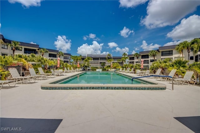 6979 Winkler Rd Unit 131, Fort Myers, FL 33919 - community pool with a patio and a residential view