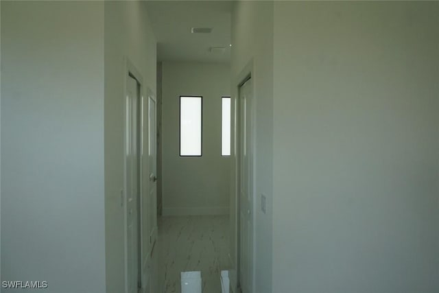 826 Alido Ave, Lehigh Acres, FL 33971 - hall with baseboards and light marble finish flooring