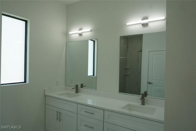826 Alido Ave, Lehigh Acres, FL 33971 - bathroom with double vanity and a shower