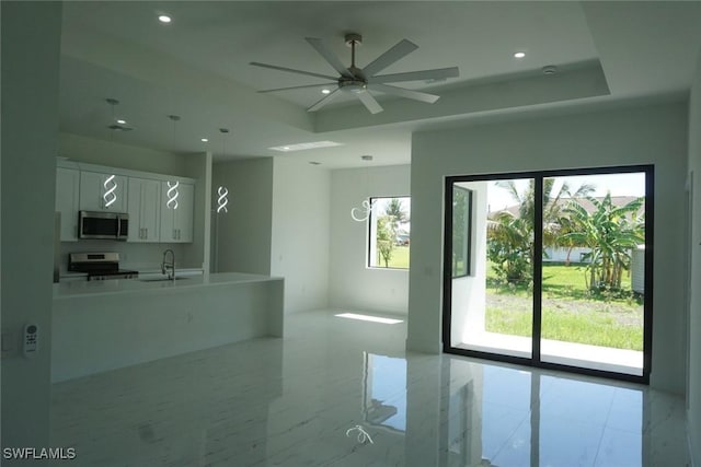 826 Alido Ave, Lehigh Acres, FL 33971 - kitchen featuring appliances with stainless steel finishes, healthy amount of natural light, white cabinets, and recessed lighting