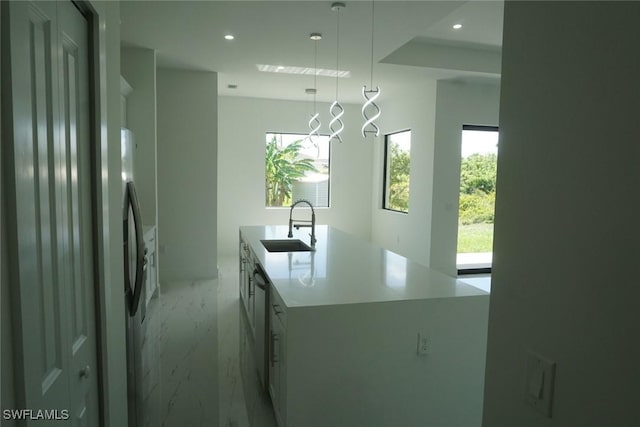 826 Alido Ave, Lehigh Acres, FL 33971 - kitchen featuring a sink, light marble finish floors, appliances with stainless steel finishes, a kitchen island with sink, and recessed lighting