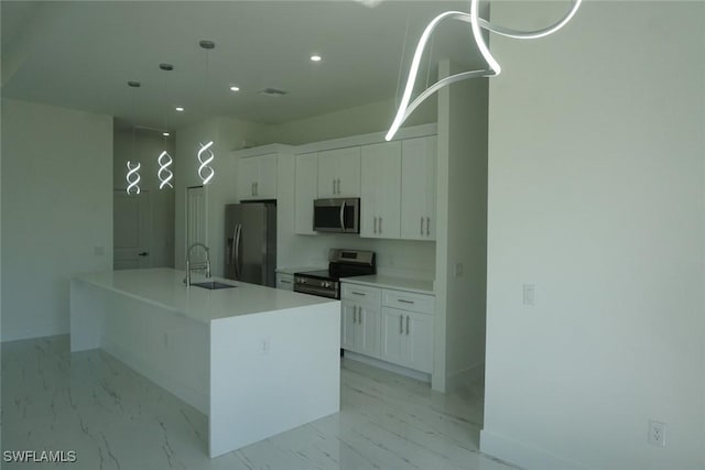 826 Alido Ave, Lehigh Acres, FL 33971 - kitchen with appliances with stainless steel finishes, a sink, white cabinets, recessed lighting, and light marble finish floors