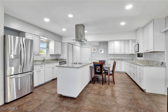 250 Bangsberg Rd SE, Port Charlotte, FL 33952 - kitchen with stainless steel appliances, a kitchen island, tasteful backsplash, a sink, and island exhaust hood