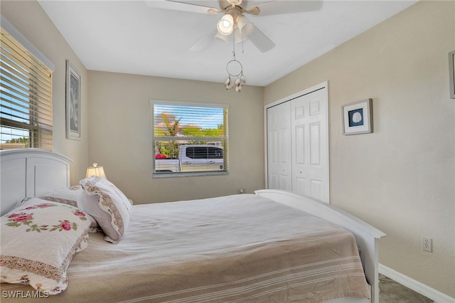 250 Bangsberg Rd SE, Port Charlotte, FL 33952 - bedroom with multiple windows, baseboards, a closet, and ceiling fan