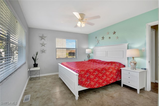250 Bangsberg Rd SE, Port Charlotte, FL 33952 - bedroom featuring ceiling fan, light tile patterned flooring, and baseboards