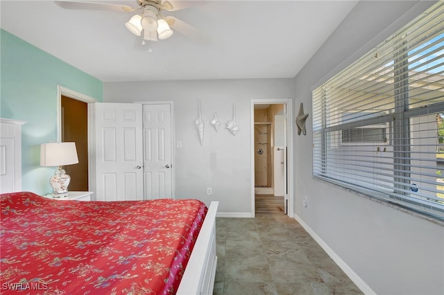 250 Bangsberg Rd SE, Port Charlotte, FL 33952 - bedroom featuring baseboards and ceiling fan