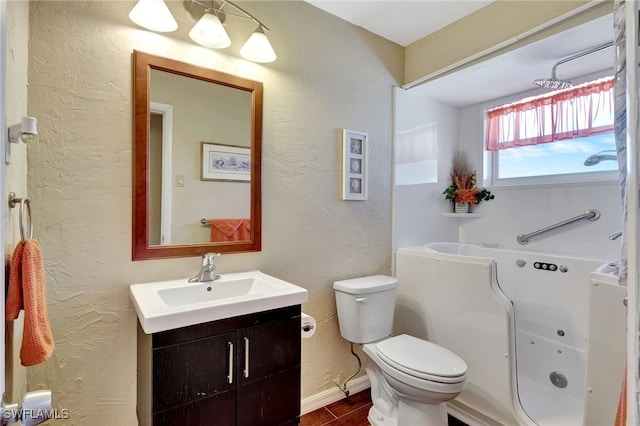 250 Bangsberg Rd SE, Port Charlotte, FL 33952 - full bathroom with toilet, vanity, a bathtub, a textured wall, and baseboards