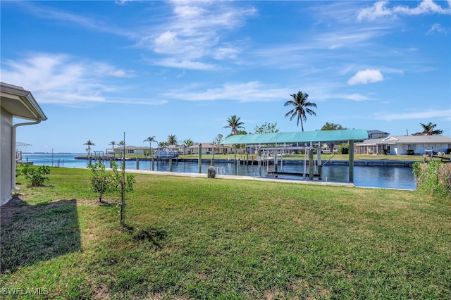 250 Bangsberg Rd SE, Port Charlotte, FL 33952 - dock area featuring a water view, a lawn, boat lift, and a residential view