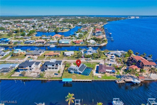 250 Bangsberg Rd SE, Port Charlotte, FL 33952 - aerial perspective of suburban area featuring a large body of water