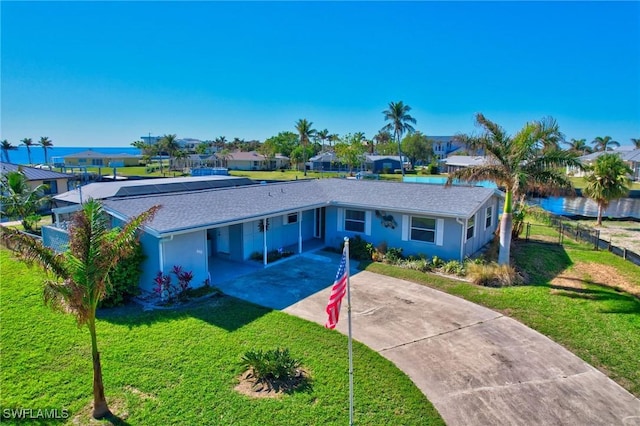 250 Bangsberg Rd SE, Port Charlotte, FL 33952 - ranch-style home with concrete driveway, an attached carport, stucco siding, and a residential view