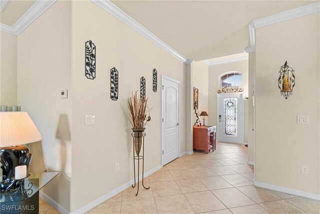 11430 Icarus Cir, Lehigh Acres, FL 33971 - hallway featuring ornamental molding, baseboards, and light tile patterned floors