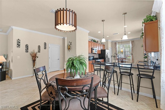 11430 Icarus Cir, Lehigh Acres, FL 33971 - dining room with crown molding, light tile patterned flooring, baseboards, and recessed lighting