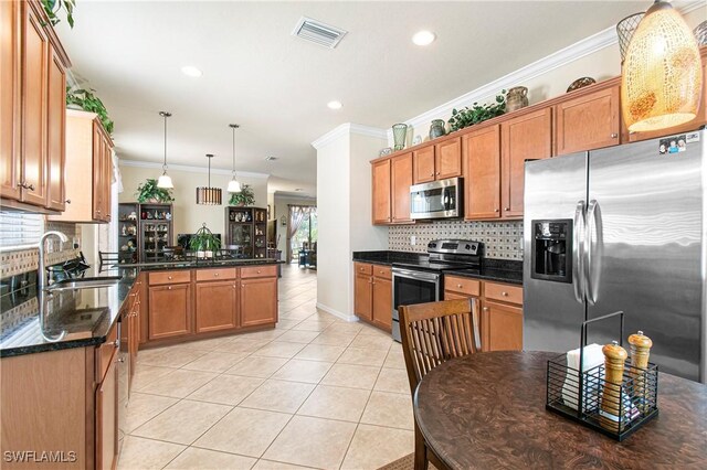 11430 Icarus Cir, Lehigh Acres, FL 33971 - kitchen featuring appliances with stainless steel finishes, crown molding, a sink, light tile patterned floors, and decorative backsplash