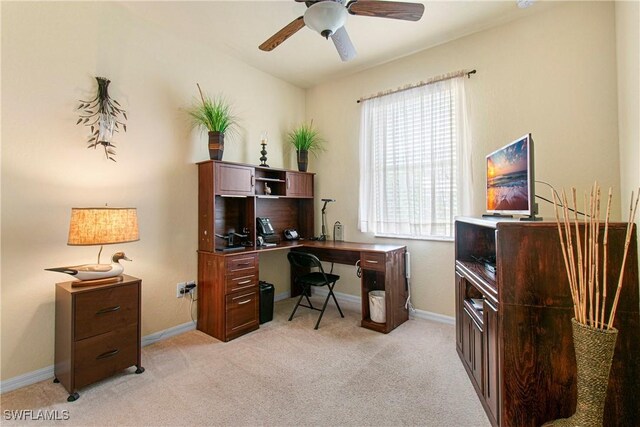 11430 Icarus Cir, Lehigh Acres, FL 33971 - office area with light colored carpet, ceiling fan, and baseboards