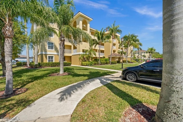 1793 Four Mile Cove Pkwy Unit 723, Cape Coral, FL 33990 - view of home's community with a lawn and a residential view