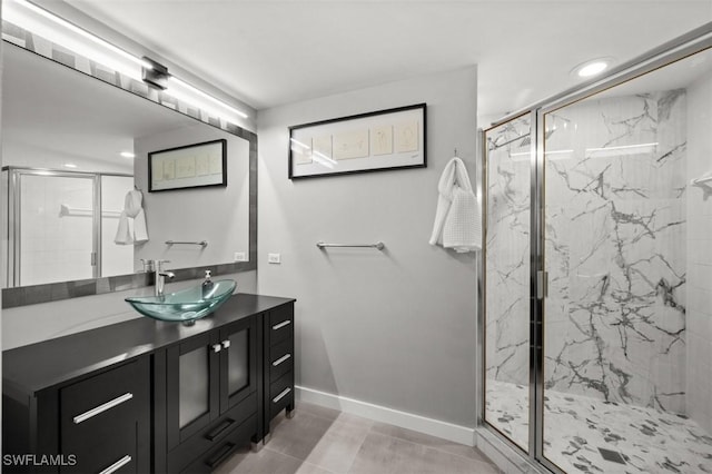 1793 Four Mile Cove Pkwy Unit 723, Cape Coral, FL 33990 - bathroom with baseboards, a marble finish shower, recessed lighting, vanity, and tile patterned floors