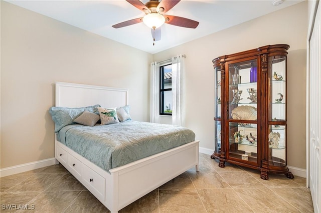 19197 Elston Way, Estero, FL 33928 - bedroom with baseboards, light tile patterned floors, and ceiling fan