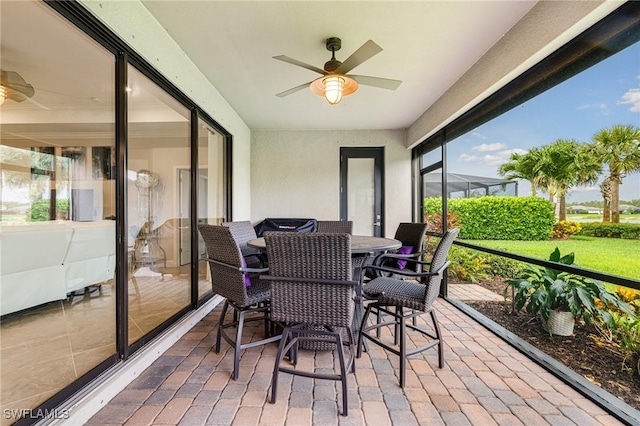 19197 Elston Way, Estero, FL 33928 - sunroom featuring ceiling fan and outdoor dining space
