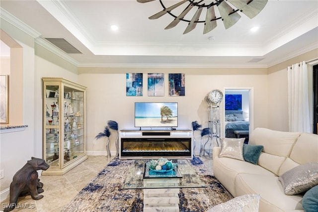 19197 Elston Way, Estero, FL 33928 - tiled living room featuring a tray ceiling, crown molding, ceiling fan, and baseboards