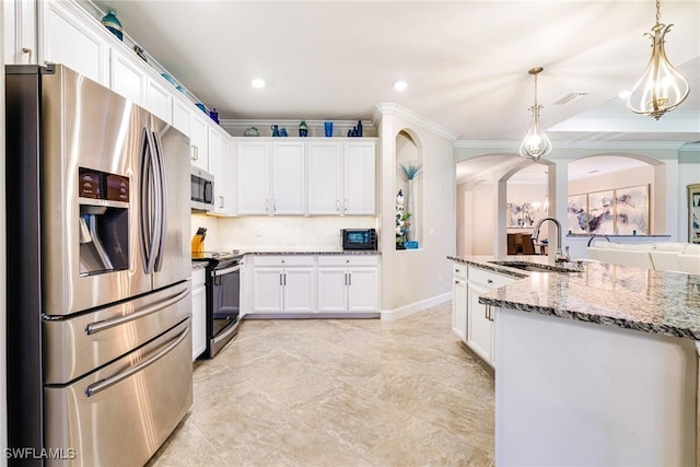 19197 Elston Way, Estero, FL 33928 - kitchen with appliances with stainless steel finishes, a sink, ornamental molding, white cabinets, and arched walkways