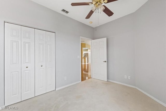 2005 Crestview Way Unit 18B, Naples, FL 34119 - unfurnished bedroom with carpet floors, baseboards, a closet, and a ceiling fan