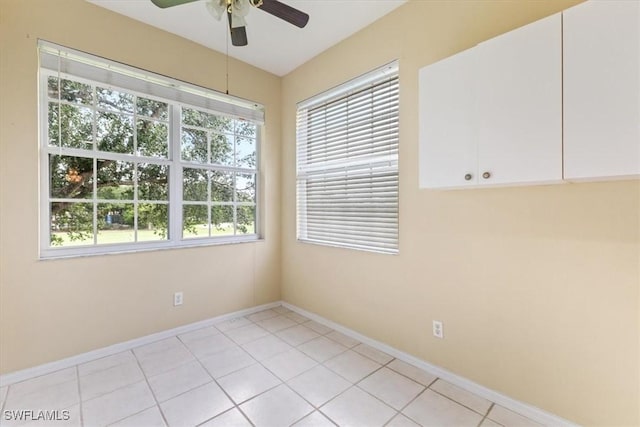 2005 Crestview Way Unit 18B, Naples, FL 34119 - spare room featuring a ceiling fan, light tile patterned floors, and baseboards