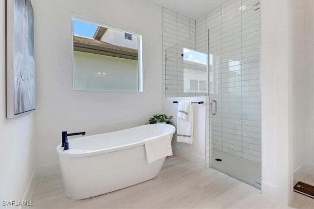 3652 Sapphire Cove Cir, Naples, FL 34114 - bathroom featuring a shower stall and a soaking tub