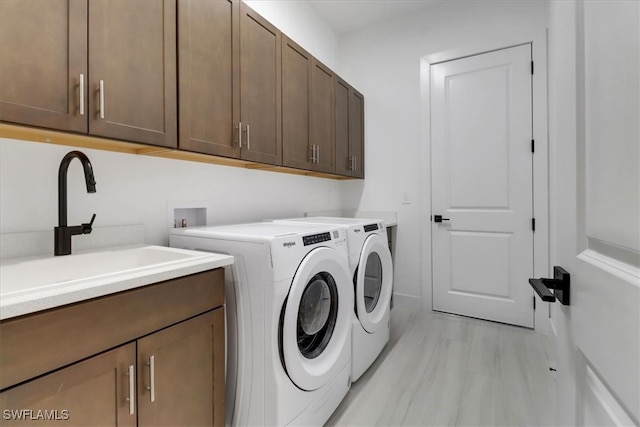 3652 Sapphire Cove Cir, Naples, FL 34114 - laundry room featuring cabinet space and washer and dryer