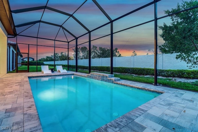 3652 Sapphire Cove Cir, Naples, FL 34114 - pool at dusk featuring a patio and a lanai
