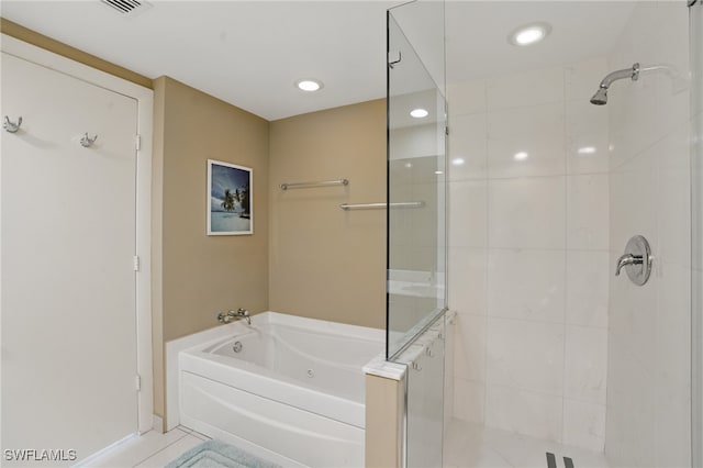 bathroom with a shower stall, a bath, tile patterned floors, and recessed lighting
