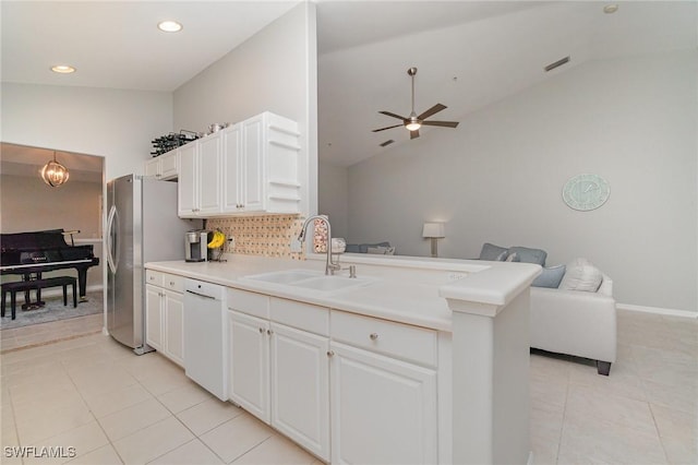 1430 Tiffany Ln Unit 2701, Naples, FL 34105 - kitchen featuring a sink, white dishwasher, open floor plan, light tile patterned floors, and a peninsula