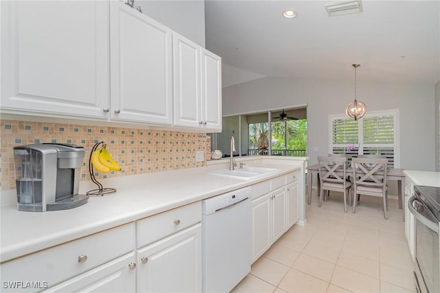 1430 Tiffany Ln Unit 2701, Naples, FL 34105 - kitchen featuring dishwasher, a sink, stainless steel electric stove, vaulted ceiling, and light tile patterned floors