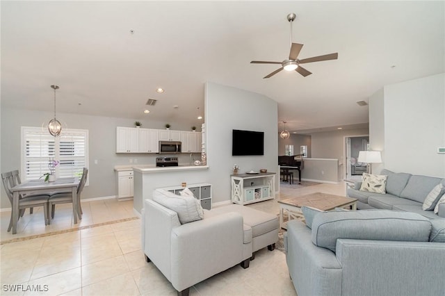 1430 Tiffany Ln Unit 2701, Naples, FL 34105 - living area featuring light tile patterned flooring, ceiling fan, baseboards, lofted ceiling, and recessed lighting