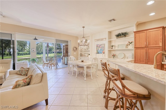 8804 Middlebrook Dr Unit 102, Fort Myers, FL 33908 - dining room featuring light tile patterned floors, recessed lighting, a ceiling fan, and a chandelier