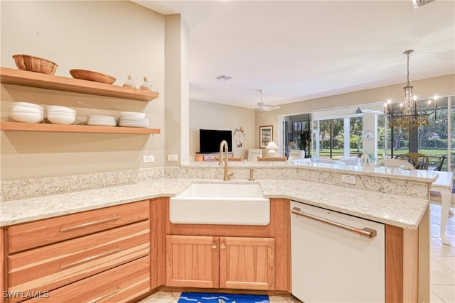 8804 Middlebrook Dr Unit 102, Fort Myers, FL 33908 - kitchen featuring white dishwasher, a sink, open shelves, light tile patterned floors, and a peninsula