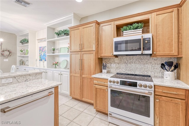 8804 Middlebrook Dr Unit 102, Fort Myers, FL 33908 - kitchen featuring open shelves, white appliances, light tile patterned floors, tasteful backsplash, and light stone counters