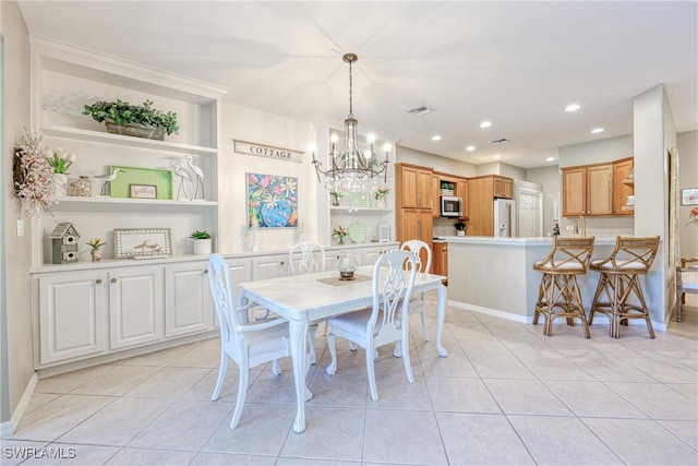 8804 Middlebrook Dr Unit 102, Fort Myers, FL 33908 - dining area featuring a chandelier, light tile patterned flooring, recessed lighting, built in features, and baseboards