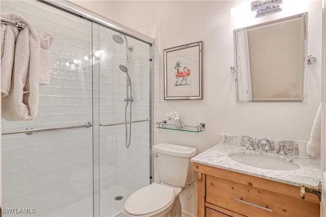 8804 Middlebrook Dr Unit 102, Fort Myers, FL 33908 - bathroom featuring toilet, vanity, and a stall shower
