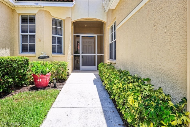 8804 Middlebrook Dr Unit 102, Fort Myers, FL 33908 - view of exterior entry featuring stucco siding