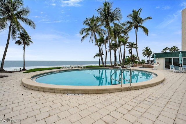 3003 Gulf Shore Blvd N Unit 404, Naples, FL 34103 - community pool with a patio and a water view