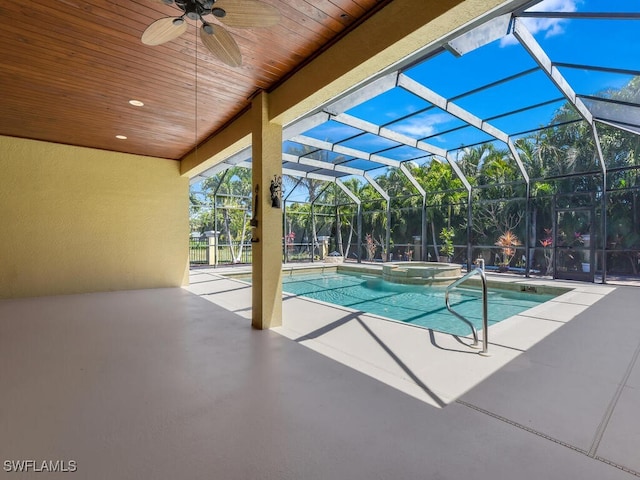 5667 Winkler Rd, Fort Myers, FL 33919 - view of swimming pool featuring ceiling fan, a patio, a pool with connected hot tub, and a lanai