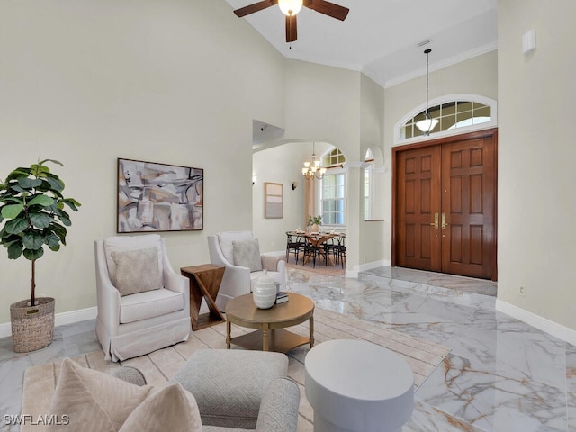5667 Winkler Rd, Fort Myers, FL 33919 - entrance foyer featuring a chandelier, marble tiled floors, crown molding, baseboards, and ceiling fan