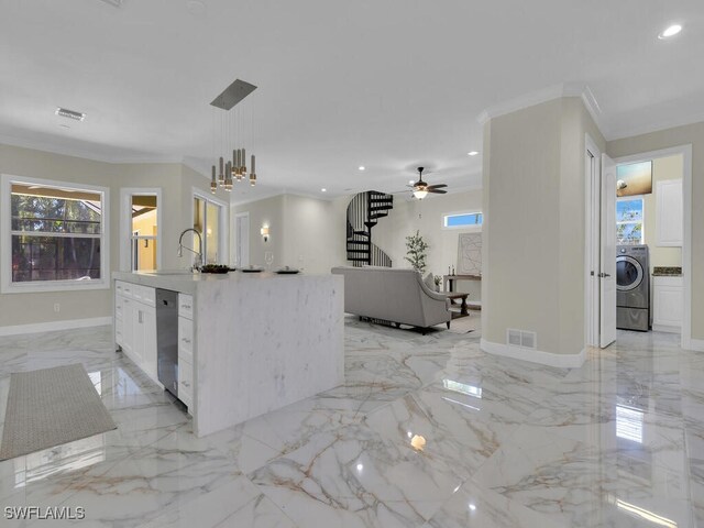 5667 Winkler Rd, Fort Myers, FL 33919 - kitchen with washer / clothes dryer, ornamental molding, light marble finish floors, healthy amount of natural light, and recessed lighting