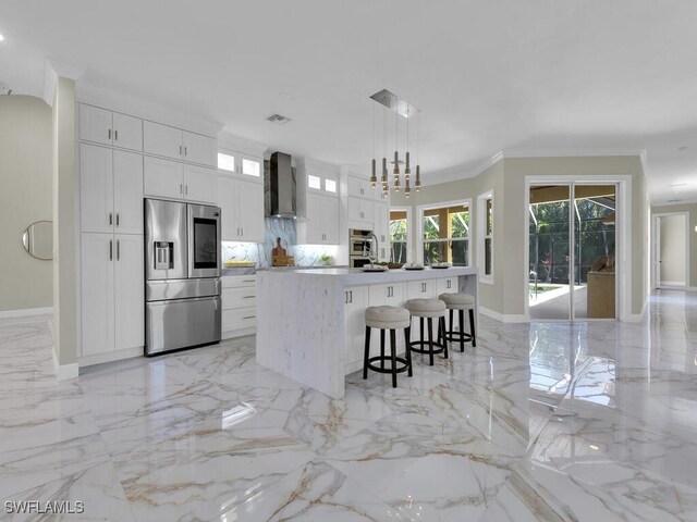 5667 Winkler Rd, Fort Myers, FL 33919 - kitchen with stainless steel fridge with ice dispenser, wall chimney exhaust hood, light marble finish flooring, a spacious island, and white cabinetry