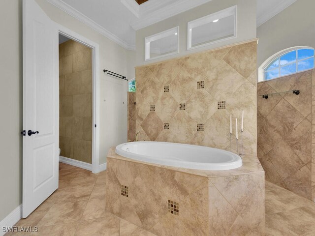 5667 Winkler Rd, Fort Myers, FL 33919 - bathroom with crown molding, a garden tub, a tile shower, and tile patterned flooring