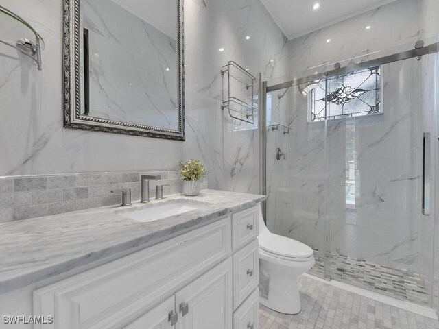 5667 Winkler Rd, Fort Myers, FL 33919 - bathroom featuring a marble finish shower, toilet, vanity, tile walls, and recessed lighting