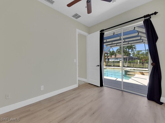 5667 Winkler Rd, Fort Myers, FL 33919 - spare room with a ceiling fan, wood finished floors, and baseboards
