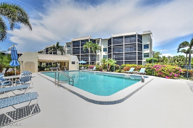 929 Collier Ct Unit B401, Marco Island, FL 34145 - community pool featuring a patio area